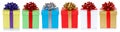 Colorful christmas presents birthday gifts in a row isolated on a white background Royalty Free Stock Photo