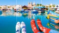 colorful Christmas socks and Maltese fishing boats at the harbor of the village Marsaxlokk Malta Royalty Free Stock Photo