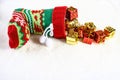 Colorful christmas stocking and lots of presents. Royalty Free Stock Photo