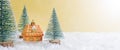 Colorful christmas toy house in the snow among the christmas trees. Background with festive lights. Real estate purchase concept Royalty Free Stock Photo