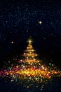 Colorful Christmas tree isolated on stars sky background. Royalty Free Stock Photo