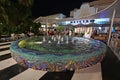 Colorful circular fountain on Lincoln Road Mall in Miami Beach, Florida at night.