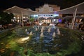 Colorful circular fountain on Lincoln Road Mall in Miami Beach, Florida at night.