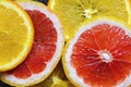 Colorful citrus fruit - orange, grapefruit - slices background. Healthy food concept, natural vitamins, diet, vegetarian food Royalty Free Stock Photo