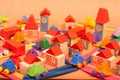 Colorful city on a orange background toys cars aeroplanes houses Royalty Free Stock Photo