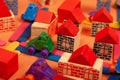 Colorful city on a orange background toys cars aeroplanes houses Royalty Free Stock Photo