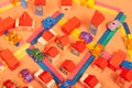 Colorful city on a orange background toys cars aeroplanes houses Royalty Free Stock Photo