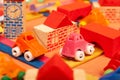 Colorful city on a orange background toys cars aeroplanes houses Royalty Free Stock Photo