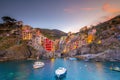 Colorful cityscape of buildings over Mediterranean sea, Europe, Cinque Terre in Italy