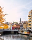 Colorful cityscape at Christianshavn channel with on bridge sightseeing hop on hop off bus passing by with motion blur. Royalty Free Stock Photo