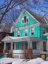 Colorful clapboard house with large porch