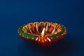 Colorful clay diya lamps shine bright, happiness and prosperity. Perfect for Diwali Holi and