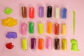 Colorful clay, plasticine with tools on a pink background Royalty Free Stock Photo