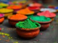 Colorful clay pots with vibrant powder in a photo, colorful holi decorations, festive ornaments, celebration concept Royalty Free Stock Photo