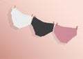 Colorful clean women`s panties hang on a rope. on a pink isolated background. vector illustration