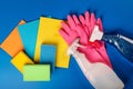 Colorful cleaning equipment on blue background