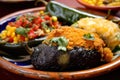 Colorful close-up of Chiles Rellenos stuffed with a mix of sauteed vegetables and cheese, served with a side of corn