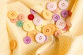 Colorful cloth button on tablecloth background