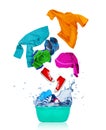 Colorful clothes flying out from blue wash bowl on white Royalty Free Stock Photo