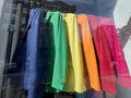colorful clothes on hangers in window display of a store Royalty Free Stock Photo