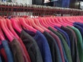 colorful clothes hanging for sale, discounted prices on every major holiday Royalty Free Stock Photo