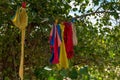 Colorful clothes hanging to dry on a laundry line and sun shining in the blue sky. Royalty Free Stock Photo