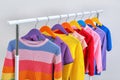 Colorful clothes hanging on wardrobe rack Royalty Free Stock Photo