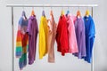 Colorful clothes hanging on wardrobe rack Royalty Free Stock Photo