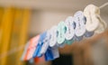Colorful clothes pegs on a rope. Royalty Free Stock Photo