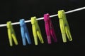 Colorful clothes pegs on a washing line Royalty Free Stock Photo