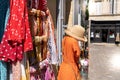 Colorful clothes on racks in street fashion boutique store