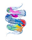 Colorful clothes rotates in a whirlpool of water Royalty Free Stock Photo