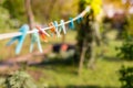 Colorful clothespin hanging on rope, depth of field Royalty Free Stock Photo