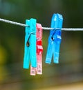 Colorful clothespin hanging on a rope Royalty Free Stock Photo