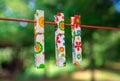 Colorful clothespins on clothesline