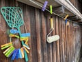 colorful clothespins hang on a wooden fence