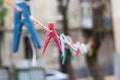 Colorful clothespins hanging on rope Royalty Free Stock Photo