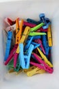 Heap of colorful clothespins are lying in a box Royalty Free Stock Photo