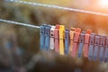 Colorful clothespins outdoor, on the rope over blur background. Royalty Free Stock Photo