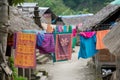 colorful clothing drying on lines between huts Royalty Free Stock Photo