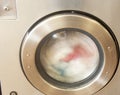 Rinse Cycle of Clothing at Laundromat Washer