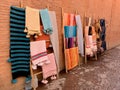 Colorful cloths and scarfs hanging for sale in the medina of Marrakech, Morocco. Royalty Free Stock Photo