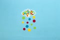 colorful cloud from which colorful dots fall, creative art design, blue sky, and dot day