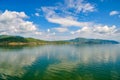 White clouds blue sky beautiful lake with wonderful mirror reflecion Royalty Free Stock Photo