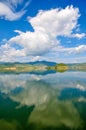 White clouds blue sky beautiful lake with wonderful mirror reflecion Royalty Free Stock Photo