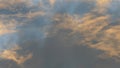 Winter clouds passing by during the evening sunset