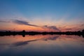 Colorful clouds after sunset, mirror reflection in lake Royalty Free Stock Photo