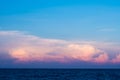 Pink clouds and sunset sky over sea Royalty Free Stock Photo
