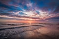 Colorful cloudy sky enhances picturesque seascape beauty