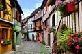 Colorful cobblestone lane in an Alsatian town, France